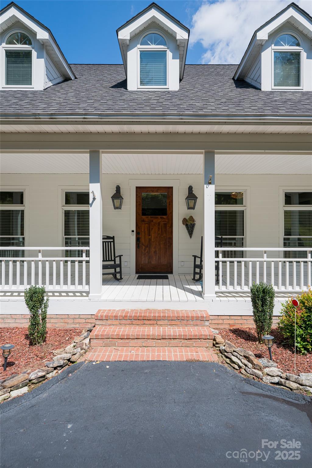 208 Parrish Farm Road Waynesville, NC 28786 - Photo 2 of 48 a front view of a house with a yard