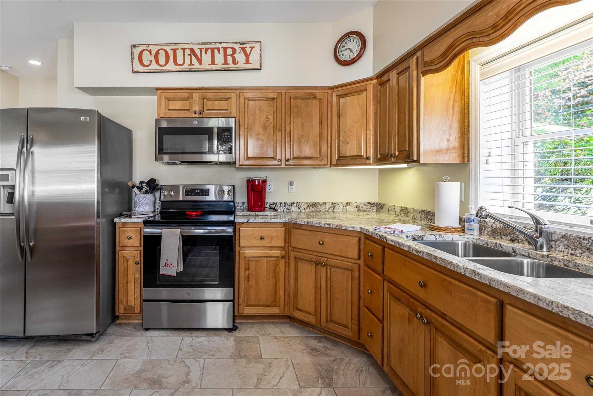 208 Parrish Farm Road Waynesville, NC 28786 - Photo 27 of 48 a kitchen with stainless steel appliances granite countertop a stove a sink and a refrigerator