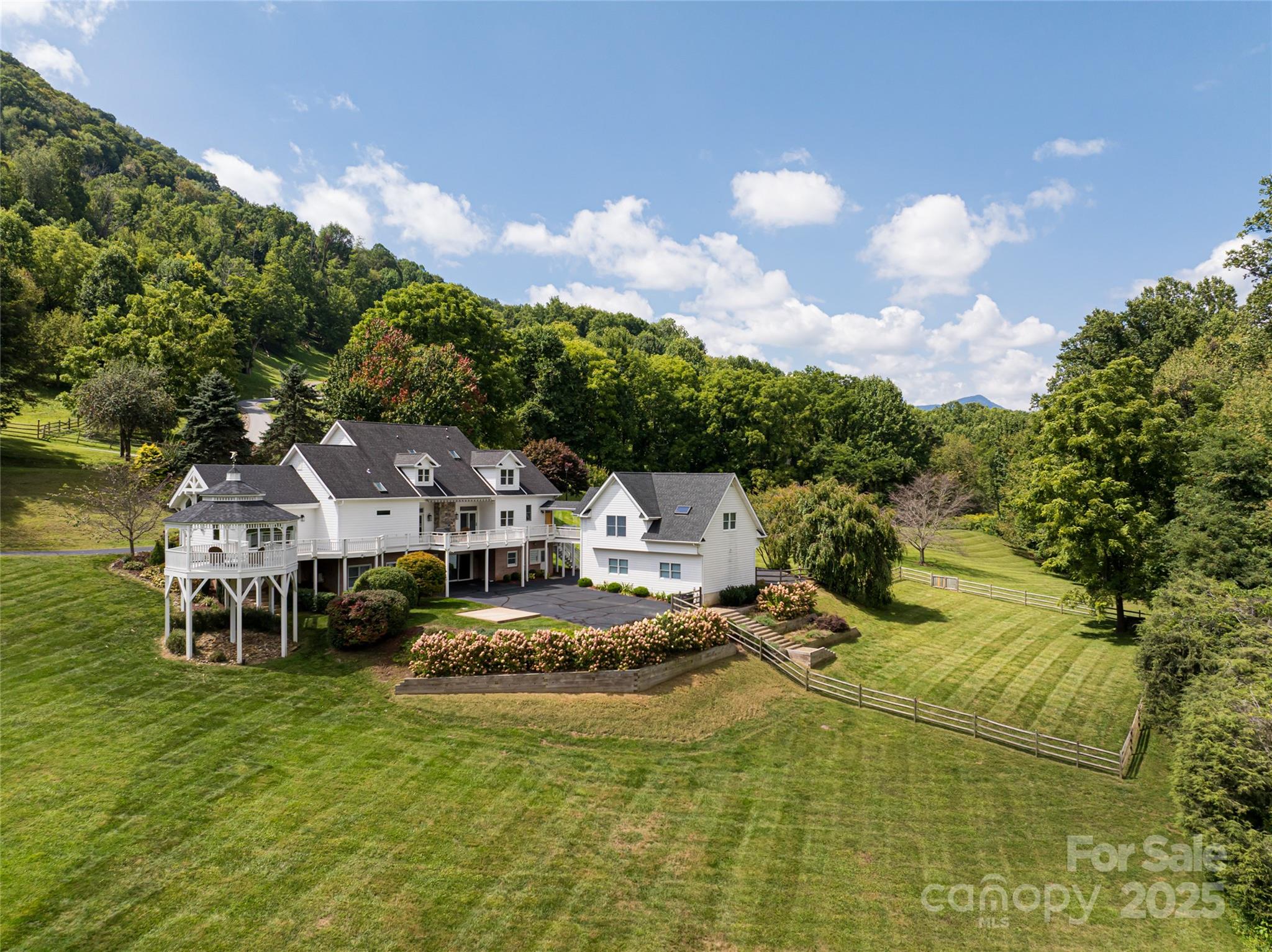 208 Parrish Farm Road Waynesville, NC 28786 - Photo 42 of 48 a view of a house with a big yard
