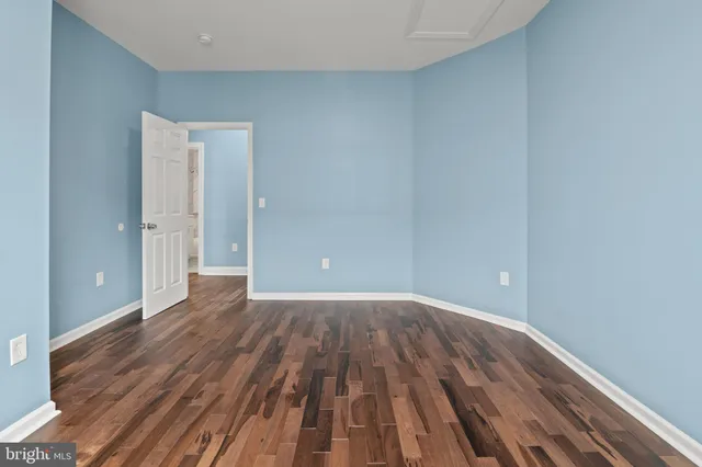 a view of a room with wooden floor