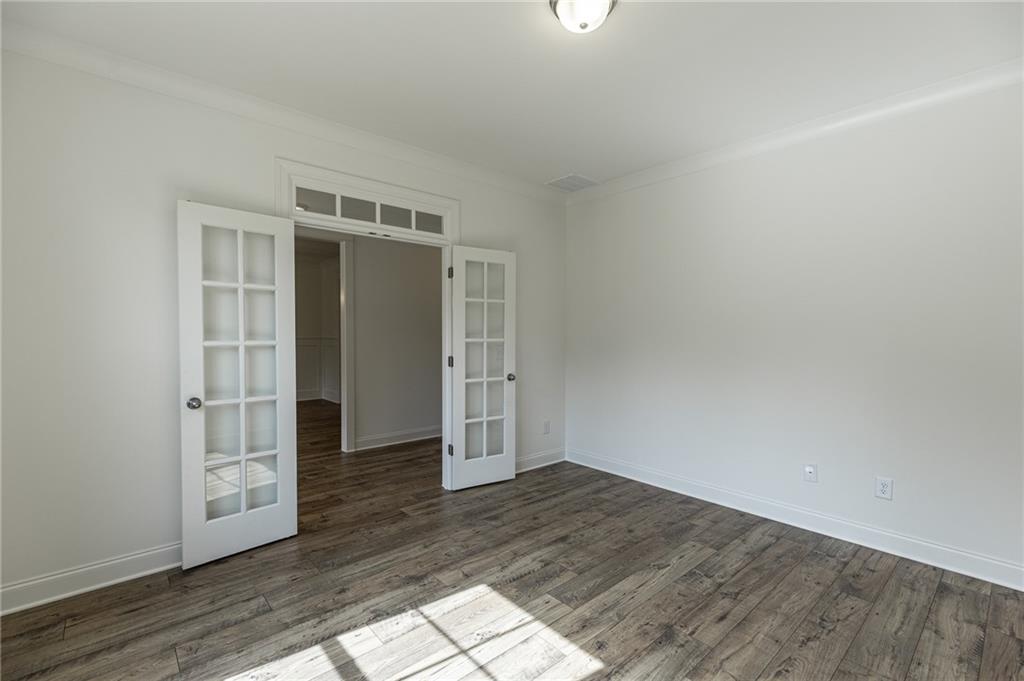 1210 Austin Road Winder, GA 30680 - Photo 9 of 56 an empty room with wooden floor and closet