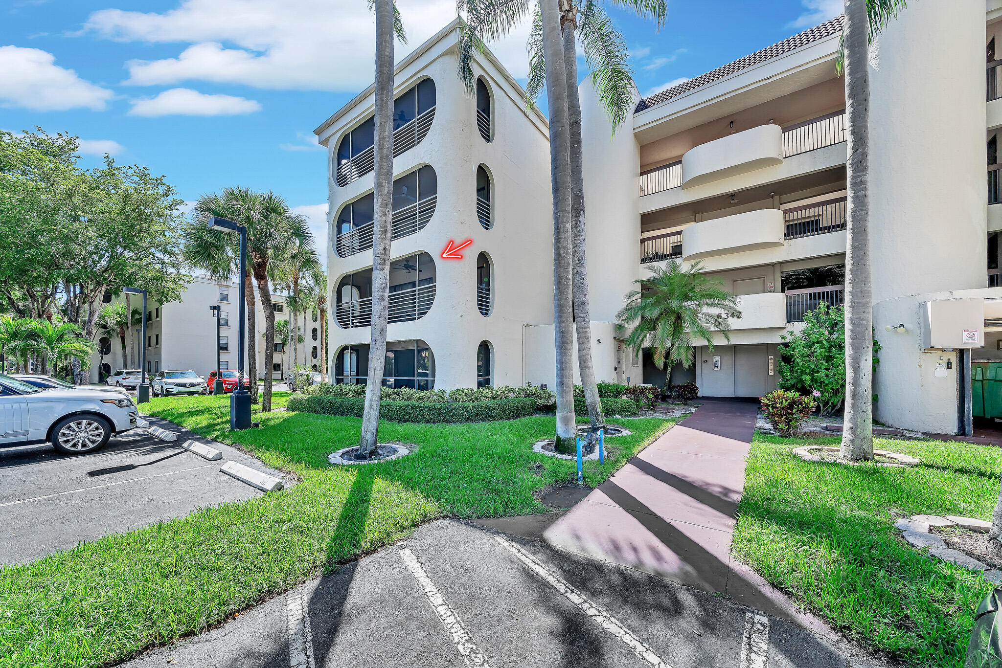 6342 Longboat Lane West, Unit 201 Boca Raton, FL 33433 - Photo 1 of 40 a view of a building with a yard