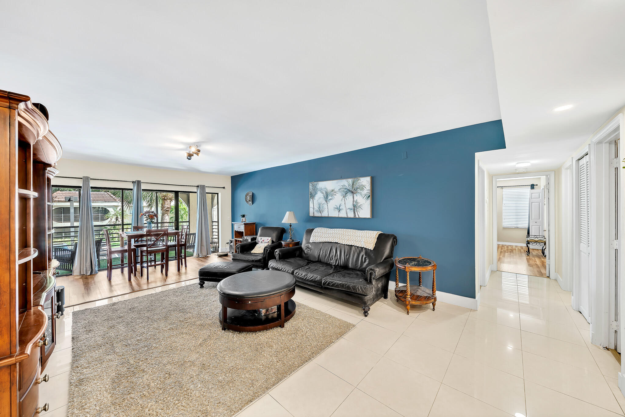 6342 Longboat Lane West, Unit 201 Boca Raton, FL 33433 - Photo 15 of 40 a living room with furniture and a large window
