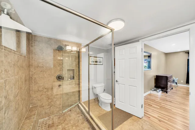 a spacious bathroom with a shower and a sink