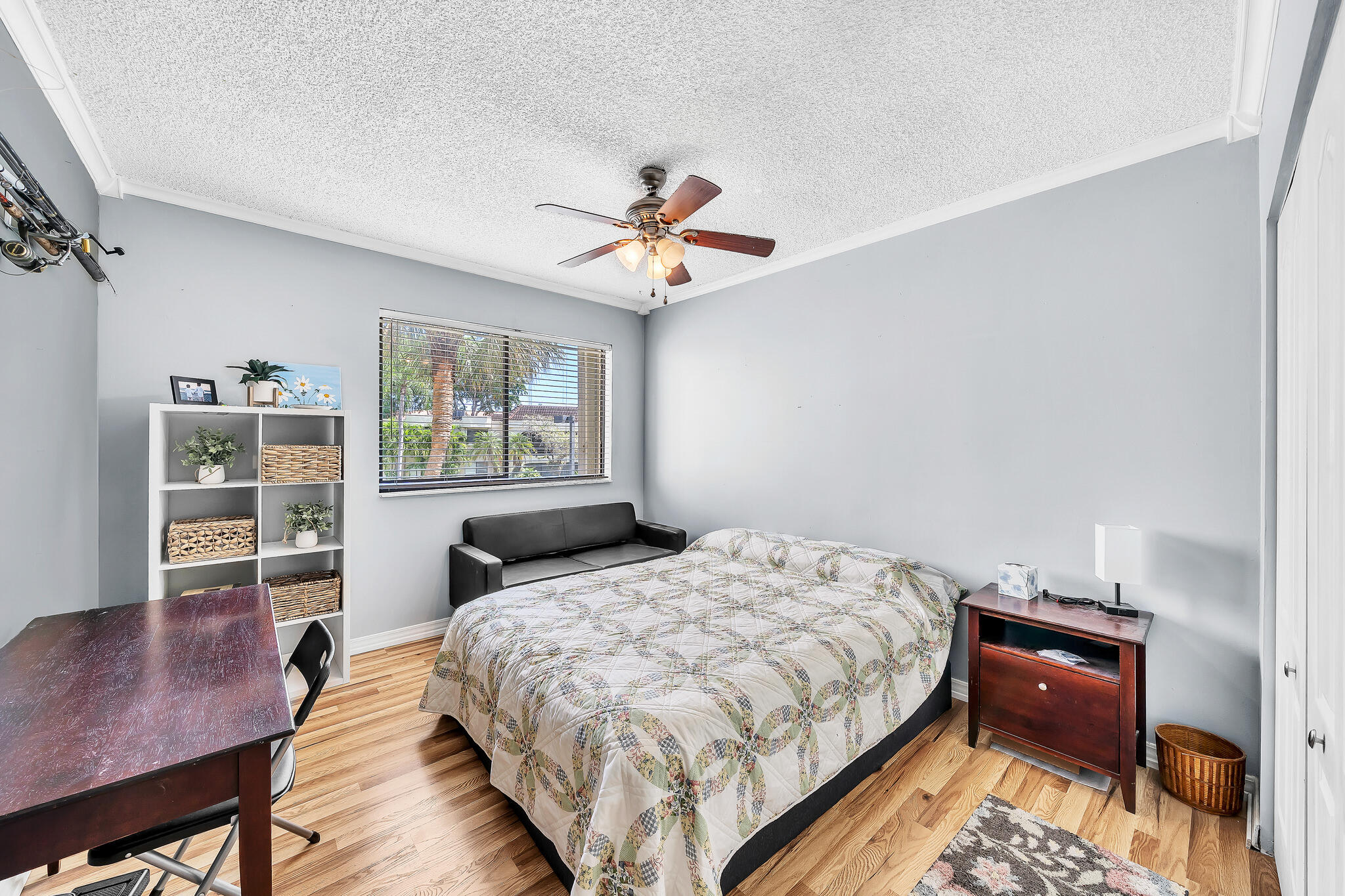 6342 Longboat Lane West, Unit 201 Boca Raton, FL 33433 - Photo 26 of 40 a bedroom with a bed and a desk with stool