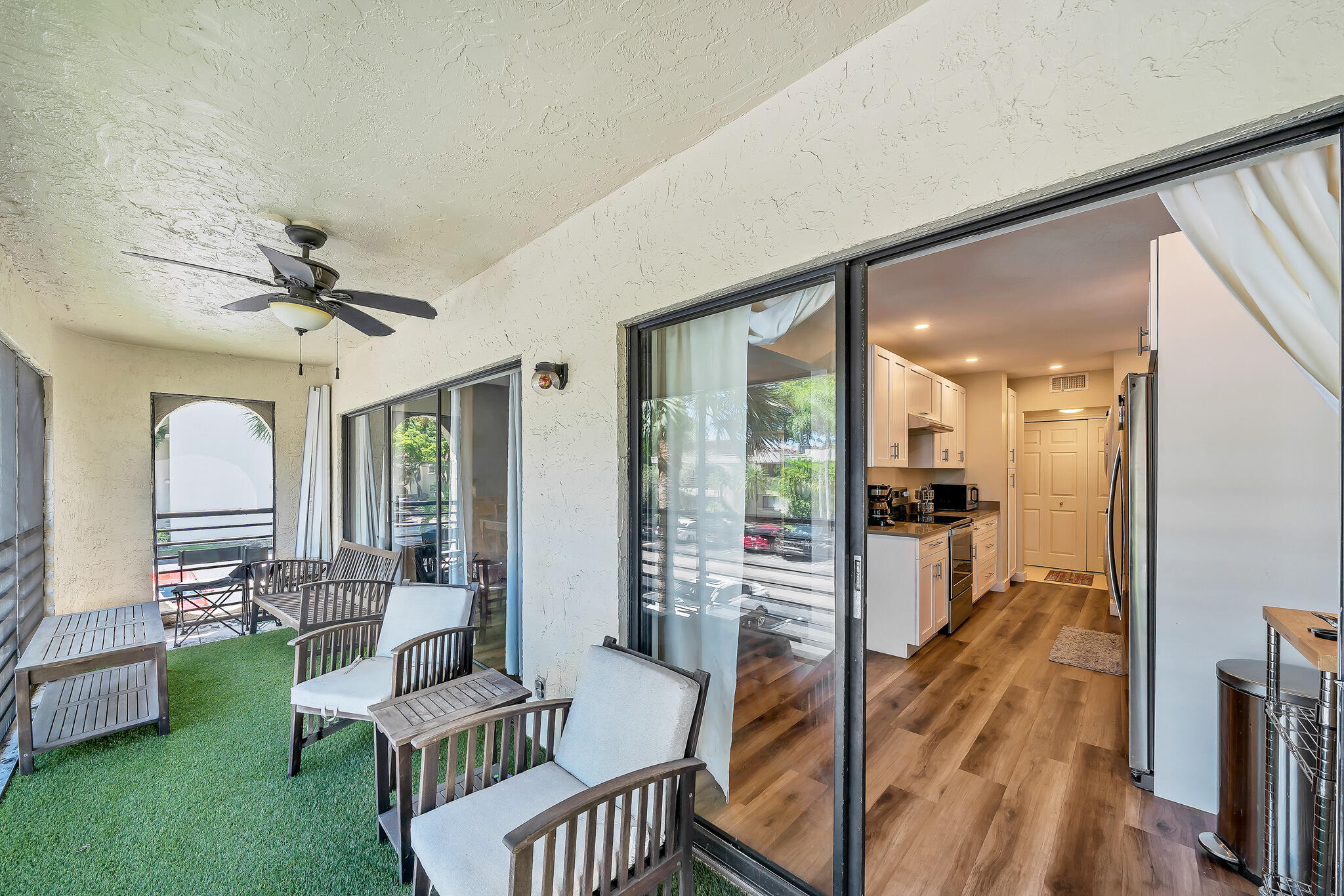 6342 Longboat Lane West, Unit 201 Boca Raton, FL 33433 - Photo 33 of 40 a living room with furniture and a large window