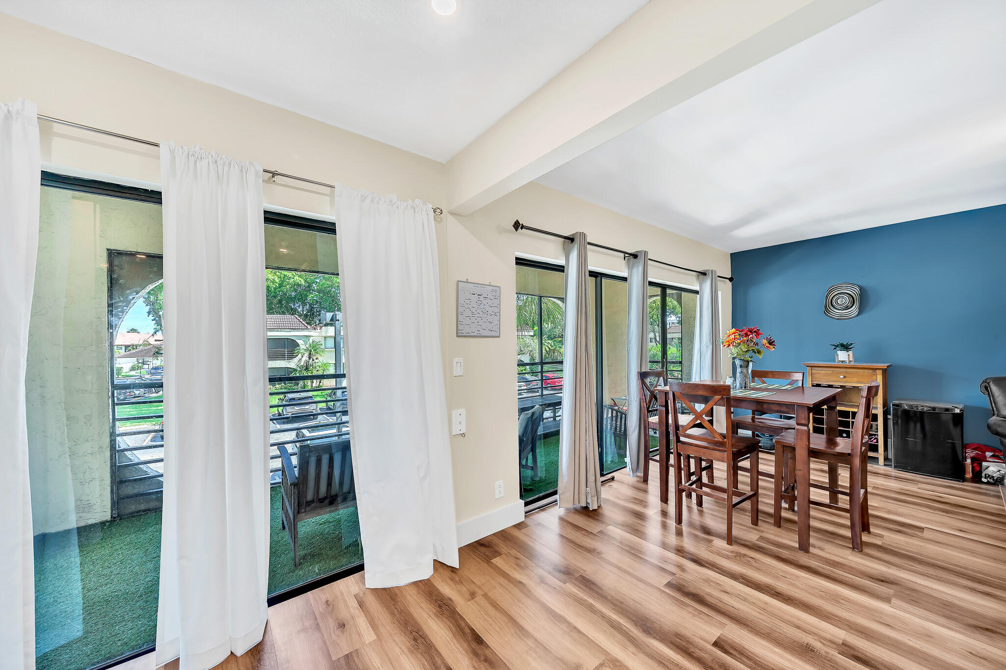 6342 Longboat Lane West, Unit 201 Boca Raton, FL 33433 - Photo 9 of 40 a dining room with furniture window and wooden floor