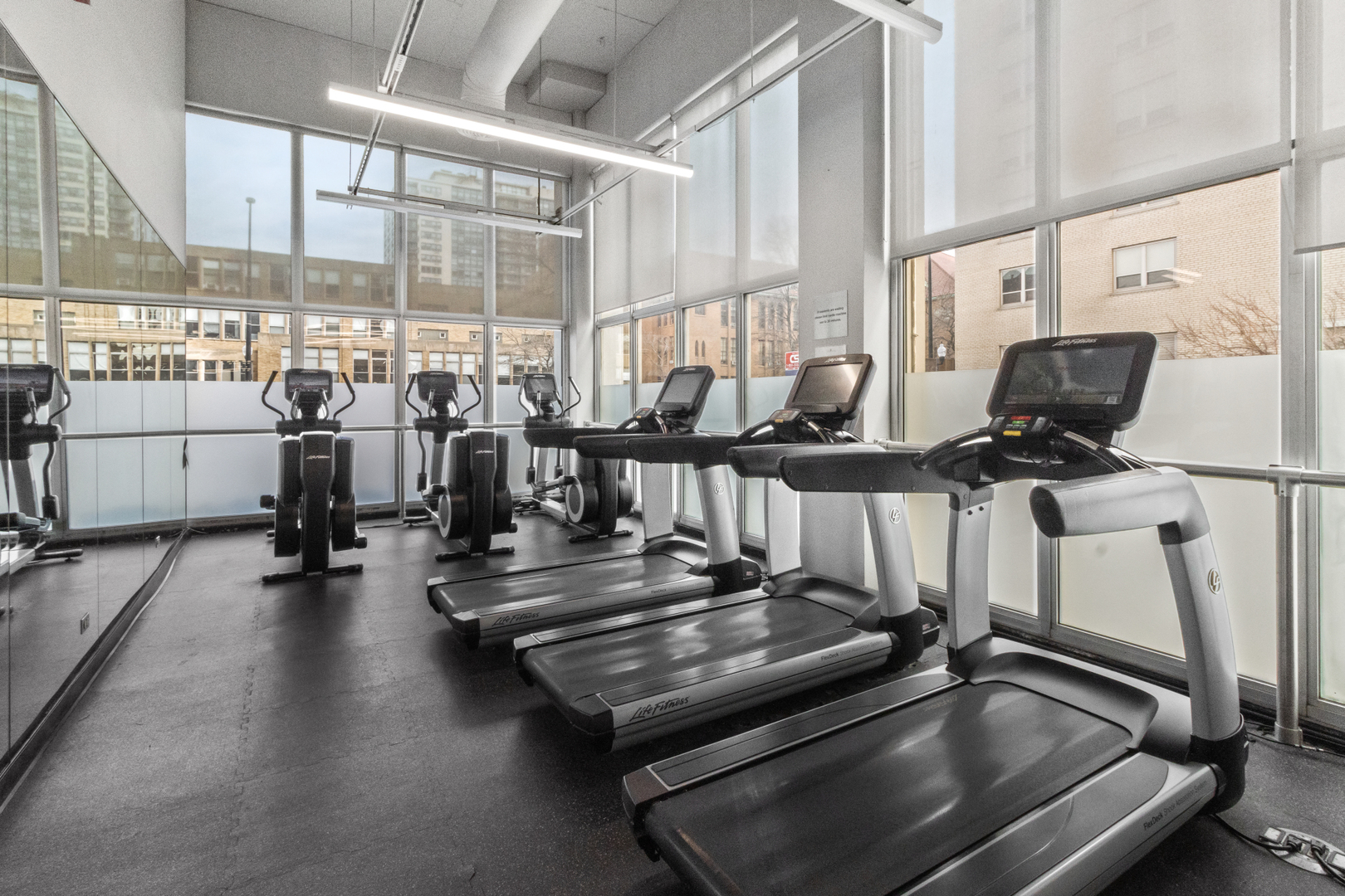 655 West Irving Park Road, Unit 4417 Chicago, IL 60613 - Photo 20 of 24 a view of a room with gym equipment