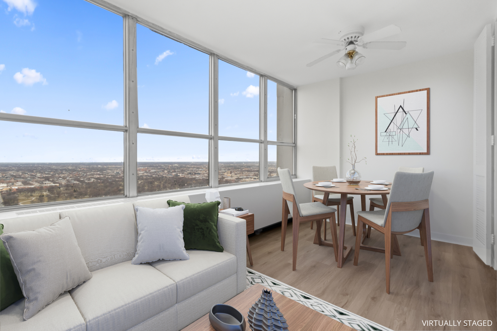 655 West Irving Park Road, Unit 4417 Chicago, IL 60613 - Photo 5 of 24 a living room with furniture wooden floor and a floor to ceiling window