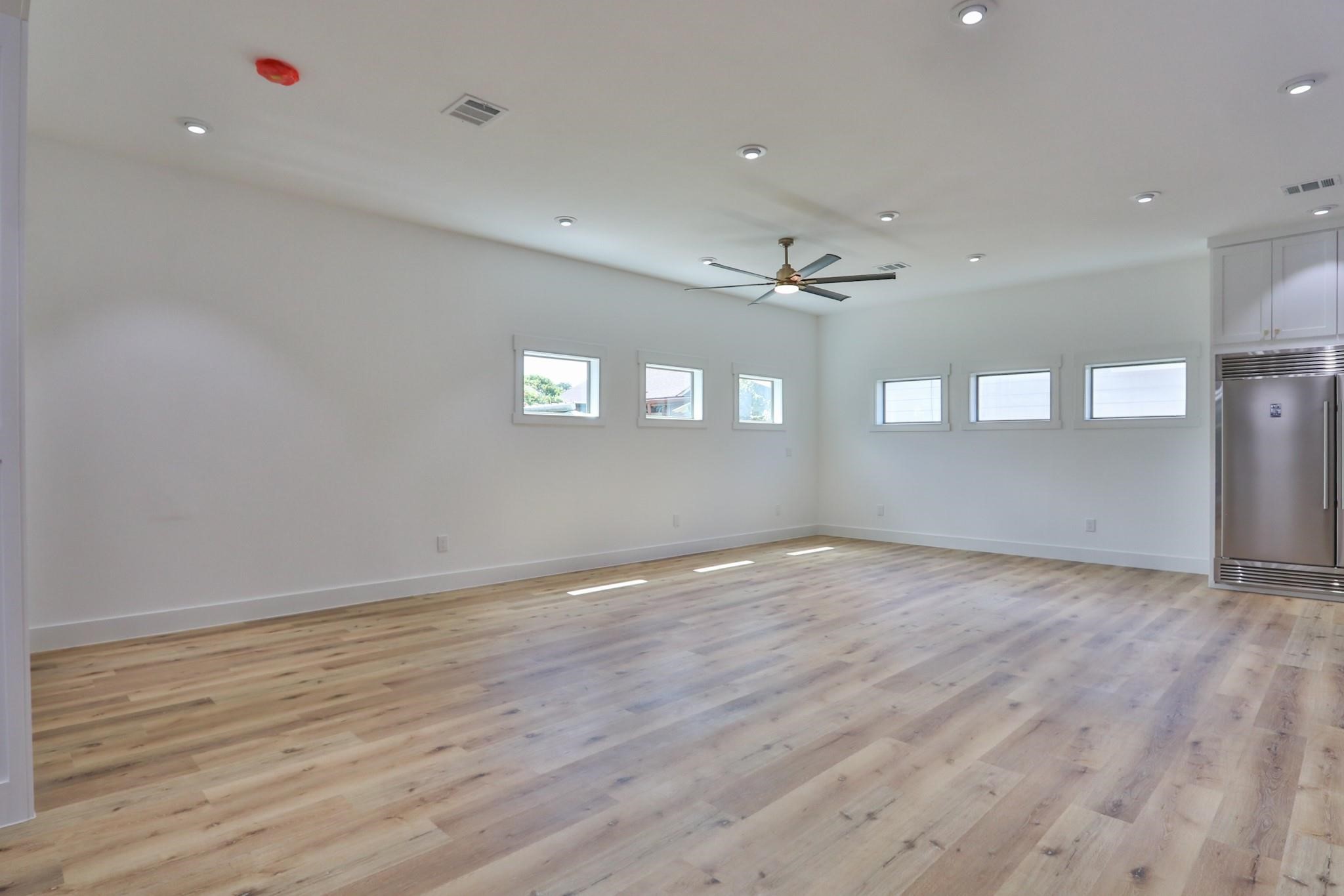 601 Cottage Street Houston, TX 77009 - Photo 24 of 48 Another view of the living room with beautiful windows and lots of space.