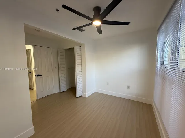 a view of an empty room with a window