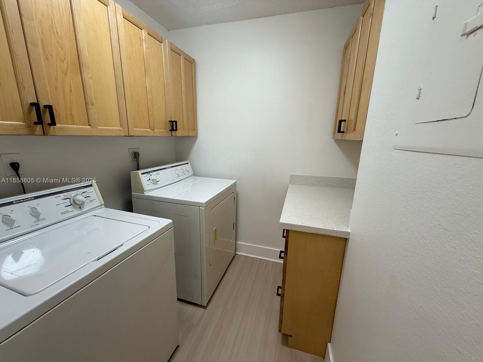 2319 North Congress Avenue, Unit 15 Boynton Beach, FL 33426 - Photo 10 of 20 a utility room with dryer and washer