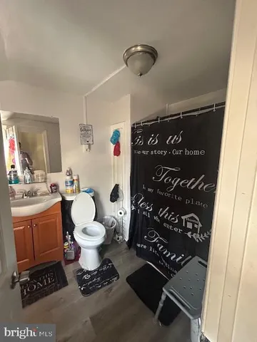 a bed room with a bed and a television