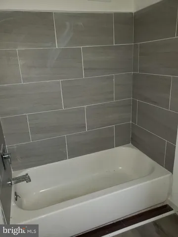 a view of a bathtub in a bathroom
