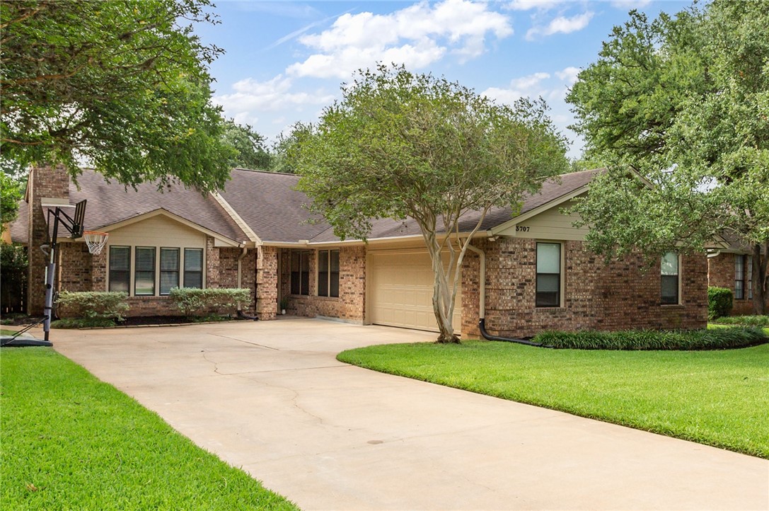 3707 Apache Forest Drive Austin, TX 78739 - Photo 1 of 1 a front view of a house with a yard and trees