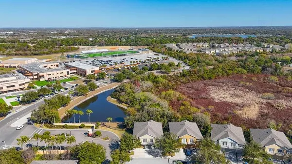 an aerial view of residential houses with outdoor space