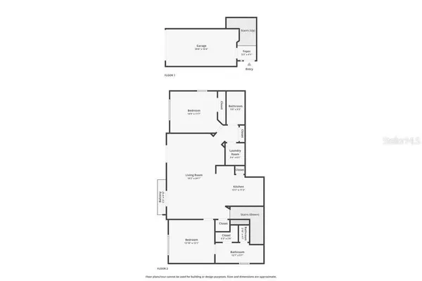 a utility room with cabinets washer and dryer