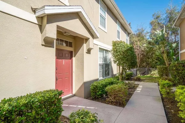 a kitchen with stainless steel appliances granite countertop a sink and a refrigerator
