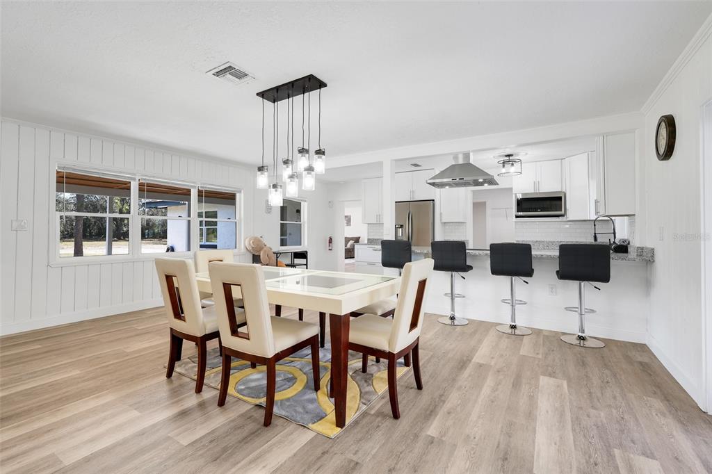 828 St Anne Shrine Road Lake Wales, FL 33898 - Photo 11 of 39 a view of a dining room with furniture and wooden floor