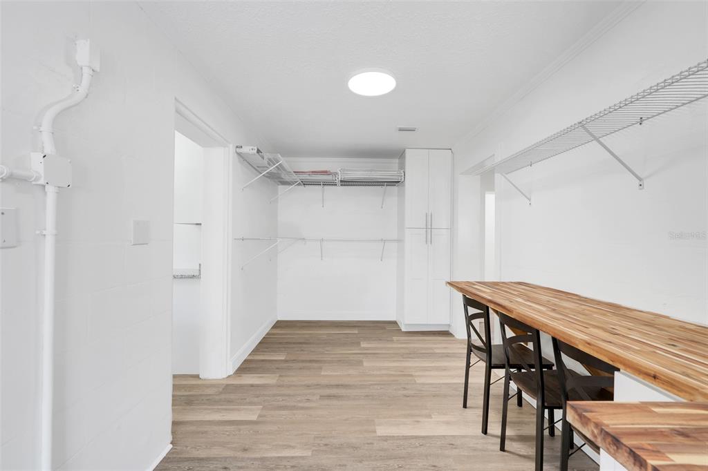 828 St Anne Shrine Road Lake Wales, FL 33898 - Photo 12 of 39 a view of a room with wooden floor wooden table and chairs