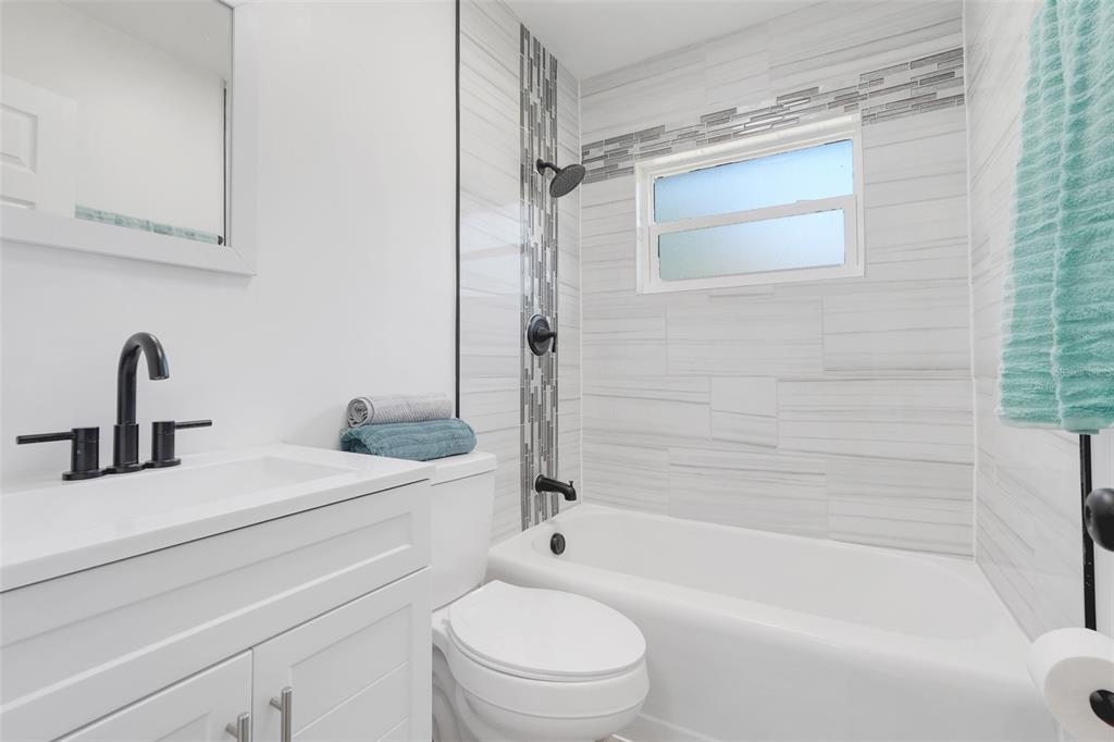 828 St Anne Shrine Road Lake Wales, FL 33898 - Photo 21 of 39 a bathroom with a sink a toilet and a bathtub