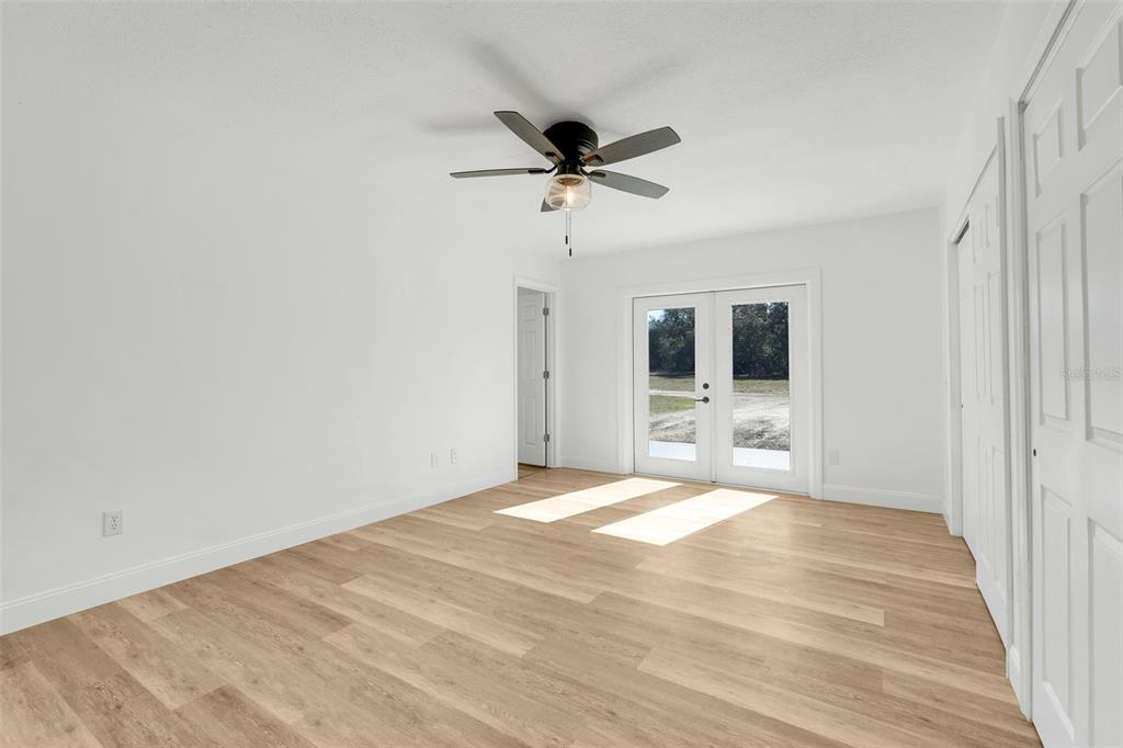 828 St Anne Shrine Road Lake Wales, FL 33898 - Photo 25 of 39 a view of a livingroom with a ceiling fan and window