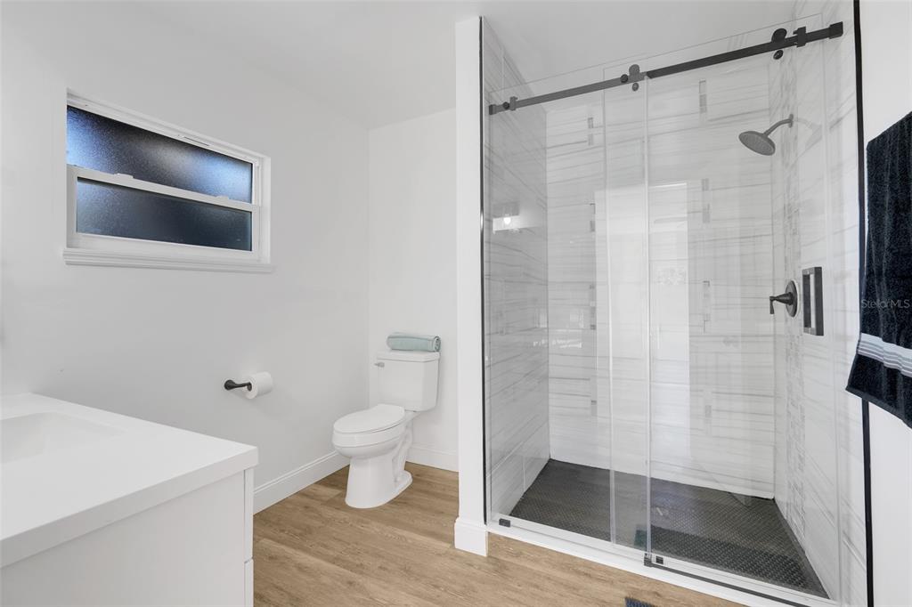 828 St Anne Shrine Road Lake Wales, FL 33898 - Photo 28 of 39 a bathroom with a shower and a toilet