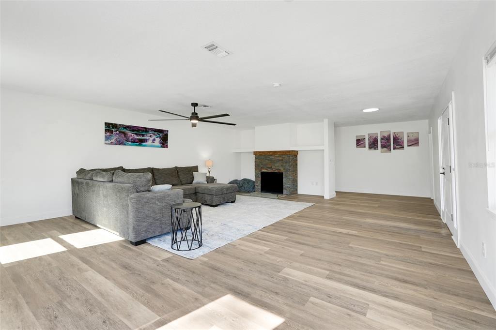 828 St Anne Shrine Road Lake Wales, FL 33898 - Photo 5 of 39 a living room with furniture and a fireplace