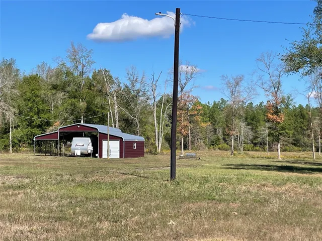a view of a yard with trees