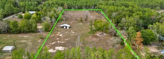 a view of a yard with an outdoor space