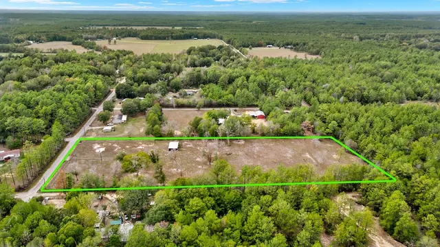 a view of a field with an ocean