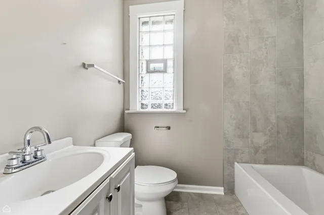 a bathroom with a sink toilet and bathtub