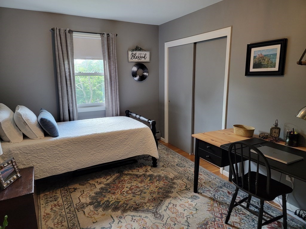 282 Old Gilbertville Road Ware, MA 01082 - Photo 15 of 31 a bedroom with a bed and a table in it