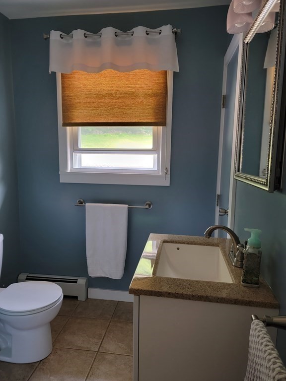 282 Old Gilbertville Road Ware, MA 01082 - Photo 16 of 31 a bathroom with a granite countertop sink and a toilet