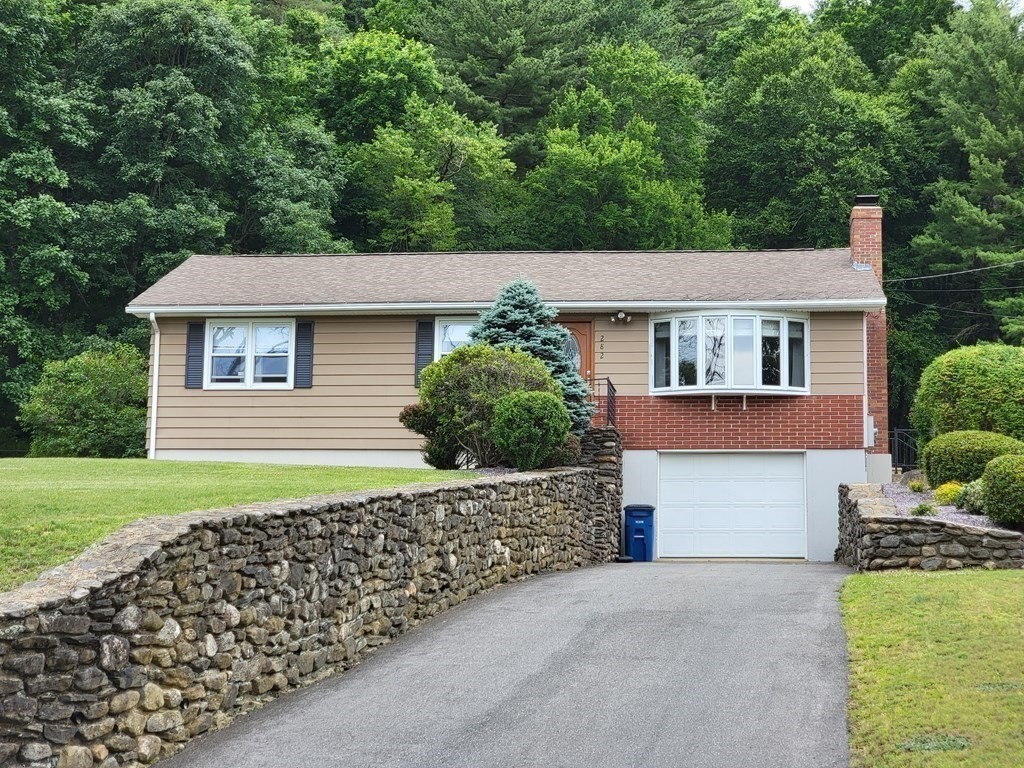 282 Old Gilbertville Road Ware, MA 01082 - Photo 2 of 31 a front view of a house with a yard and garage