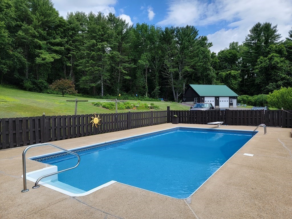 282 Old Gilbertville Road Ware, MA 01082 - Photo 25 of 31 a view of a swimming pool with a yard