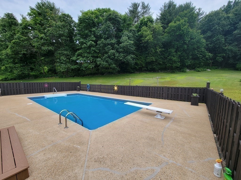 282 Old Gilbertville Road Ware, MA 01082 - Photo 27 of 31 a view of swimming pool with seating area and green space