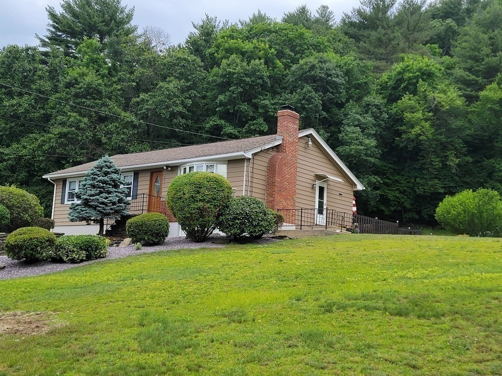 282 Old Gilbertville Road Ware, MA 01082 - Photo 3 of 31 a view of a house with a yard and plants