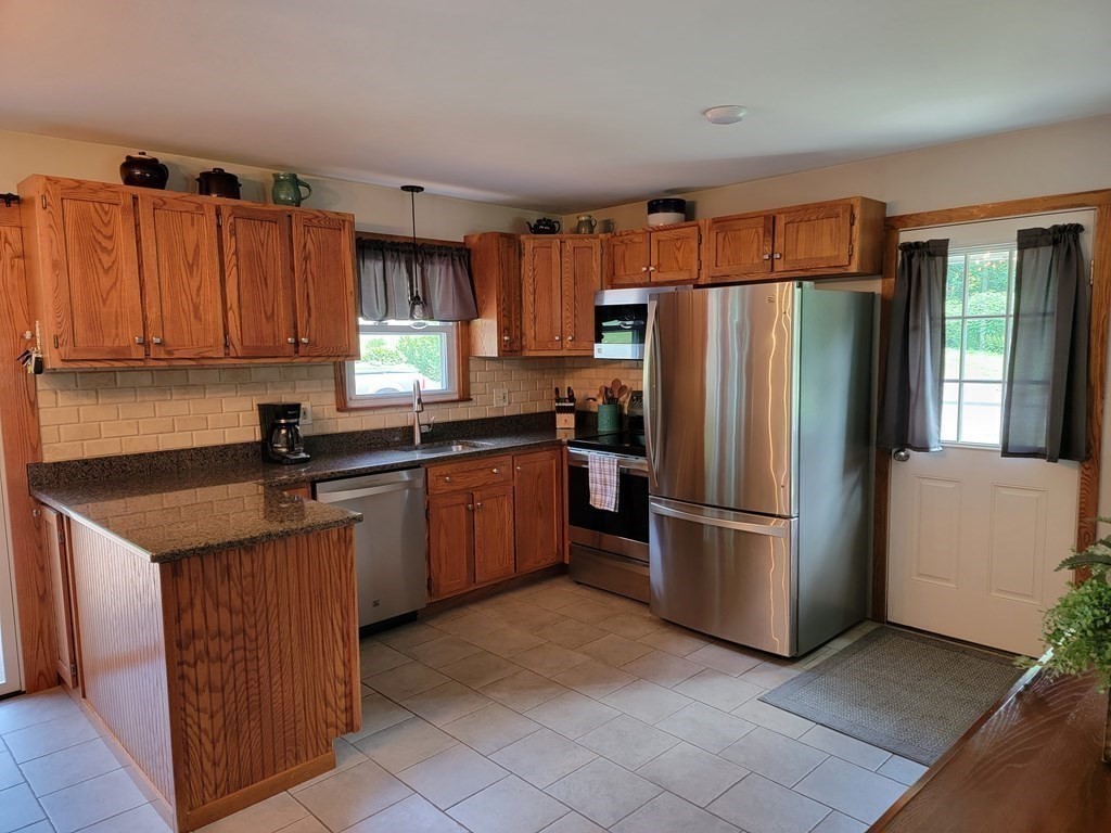 282 Old Gilbertville Road Ware, MA 01082 - Photo 9 of 31 a kitchen with stainless steel appliances granite countertop a refrigerator stove a sink and dishwasher
