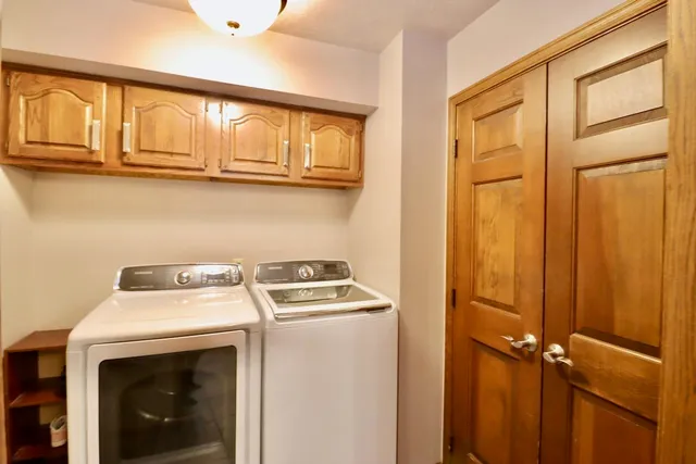 a utility room with dryer and washer