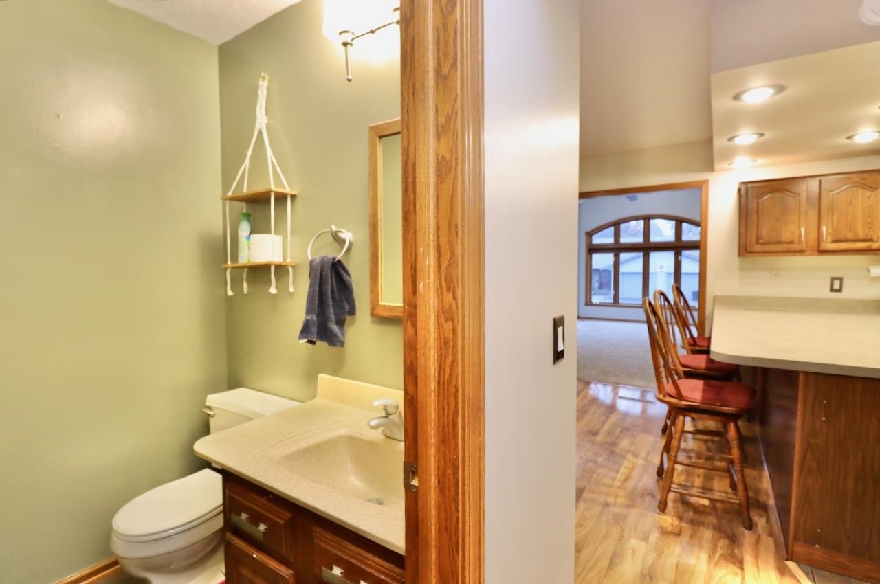 543 Fieldcrest Road Belvidere, IL 61008 - Photo 13 of 24 a bathroom with a sink a toilet and a mirror