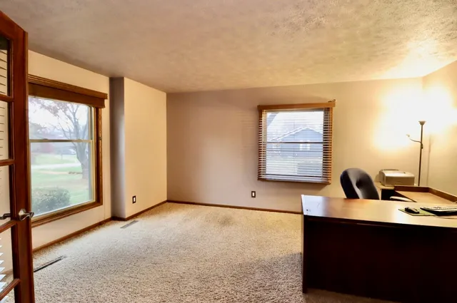 a view of room with window and bathroom