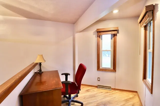 a workspace with furniture and window