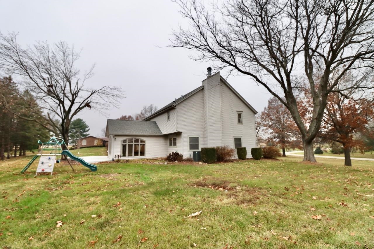 543 Fieldcrest Road Belvidere, IL 61008 - Photo 22 of 24 a view of a house with a yard
