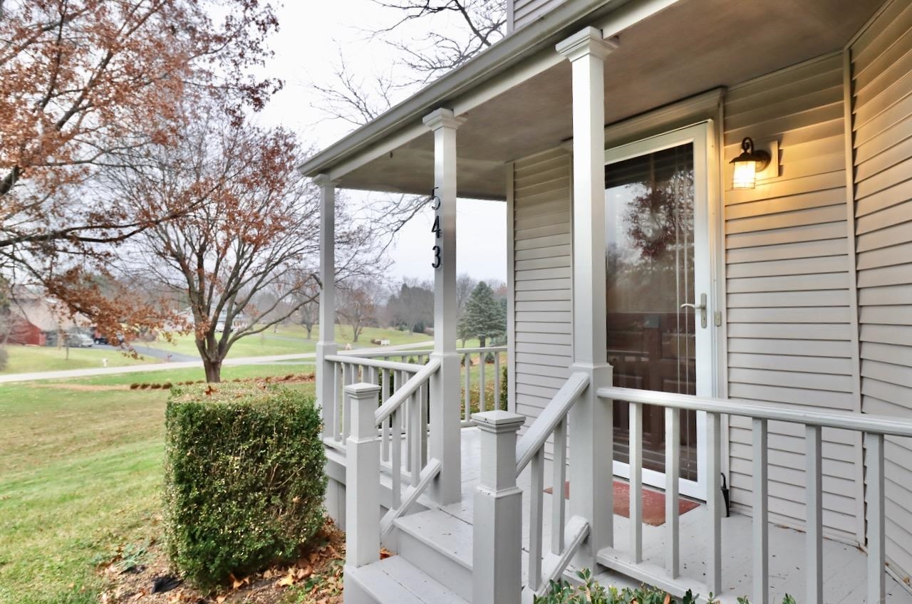 543 Fieldcrest Road Belvidere, IL 61008 - Photo 3 of 24 a view of a house with a big yard and large tree