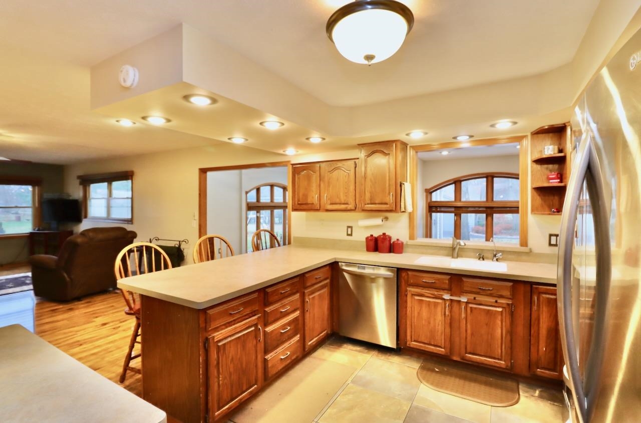 543 Fieldcrest Road Belvidere, IL 61008 - Photo 9 of 24 a kitchen with a sink and a refrigerator