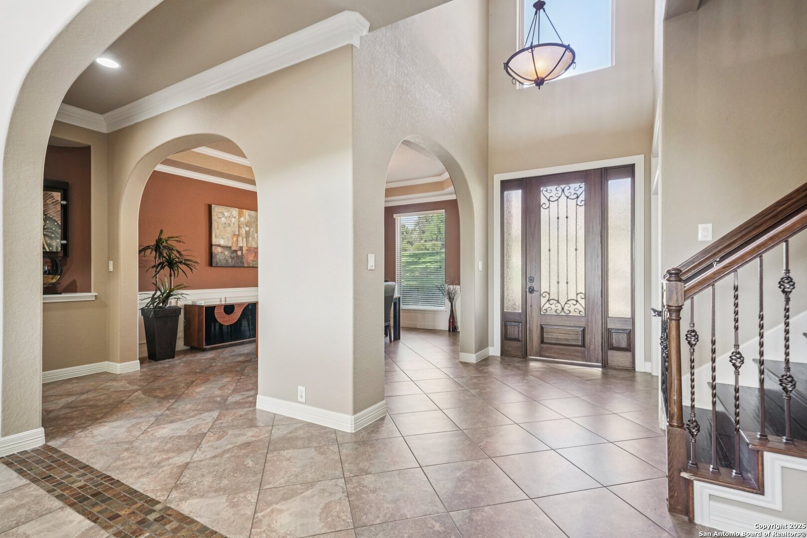 718 Ruidosa Downs Helotes, TX 78023 - Photo 18 of 50 a view of a hallway with wooden floor and a living room