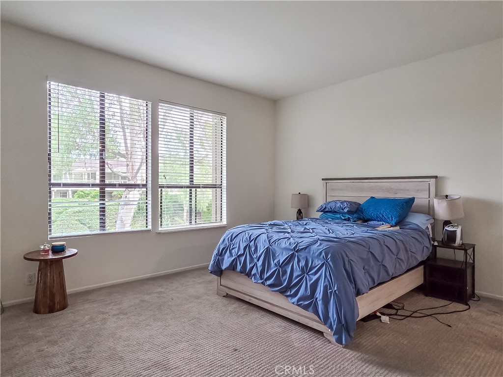 59 Rainbow Ridge Irvine, CA 92603 - Photo 13 of 35 a bedroom with a bed and a window