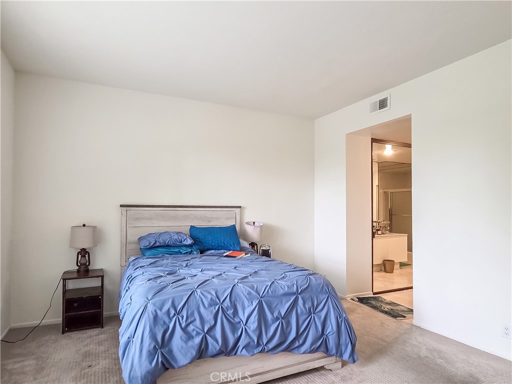 59 Rainbow Ridge Irvine, CA 92603 - Photo 14 of 35 a bedroom with a bed and a lamp with window