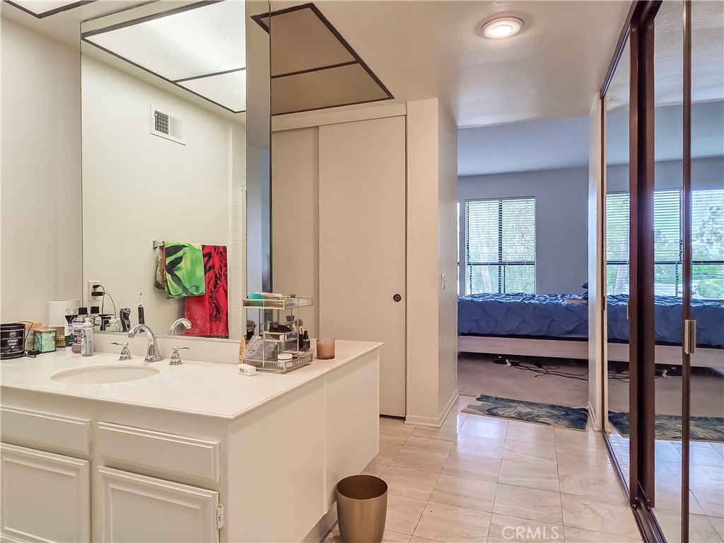 59 Rainbow Ridge Irvine, CA 92603 - Photo 16 of 35 a bathroom with a sink and a mirror